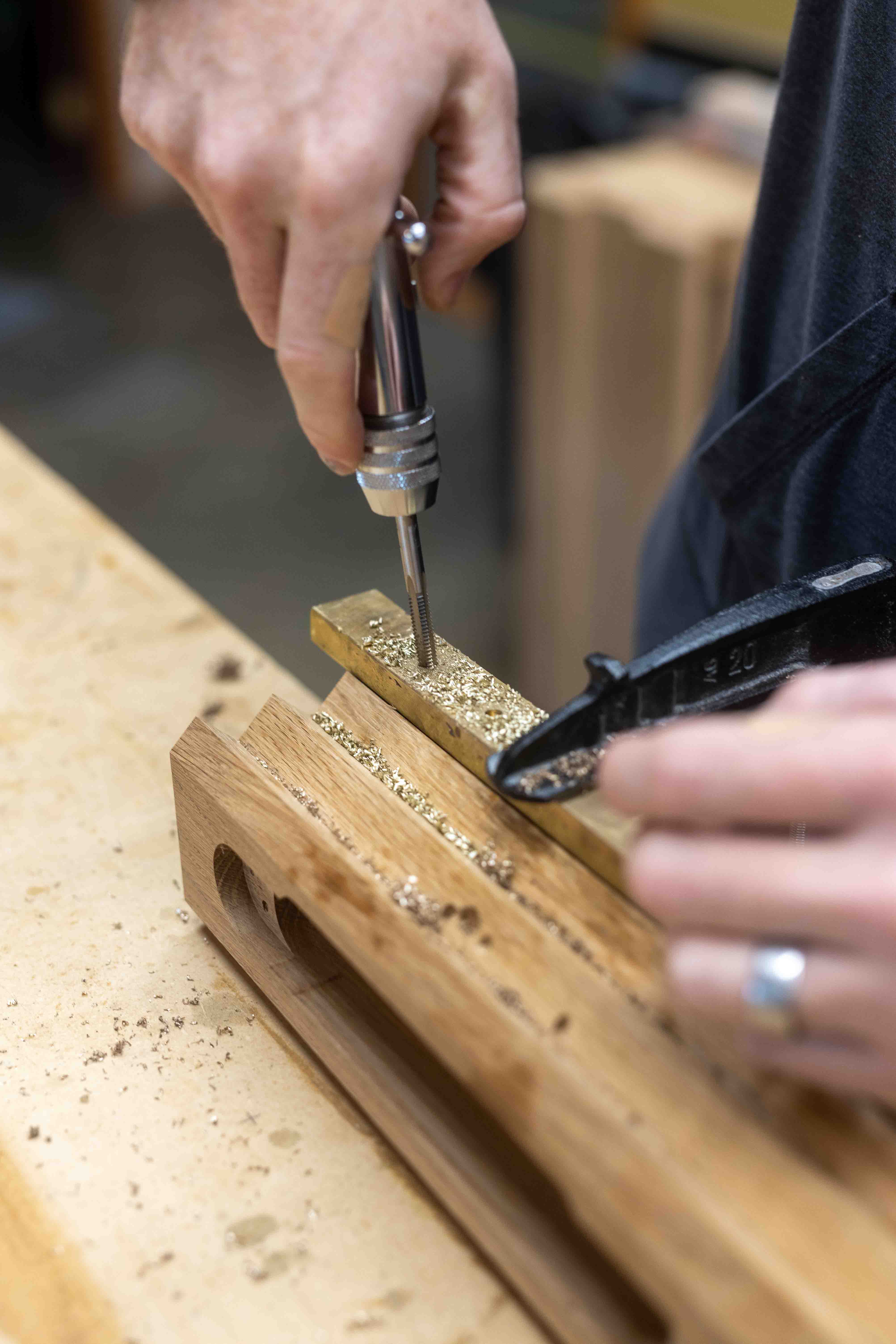 Brass inlay detail — precision joinery