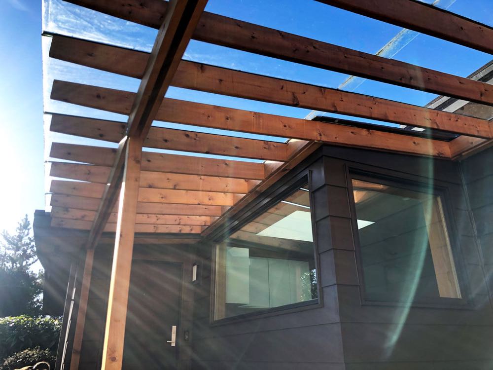 Cedar pergola with tempered glass panels